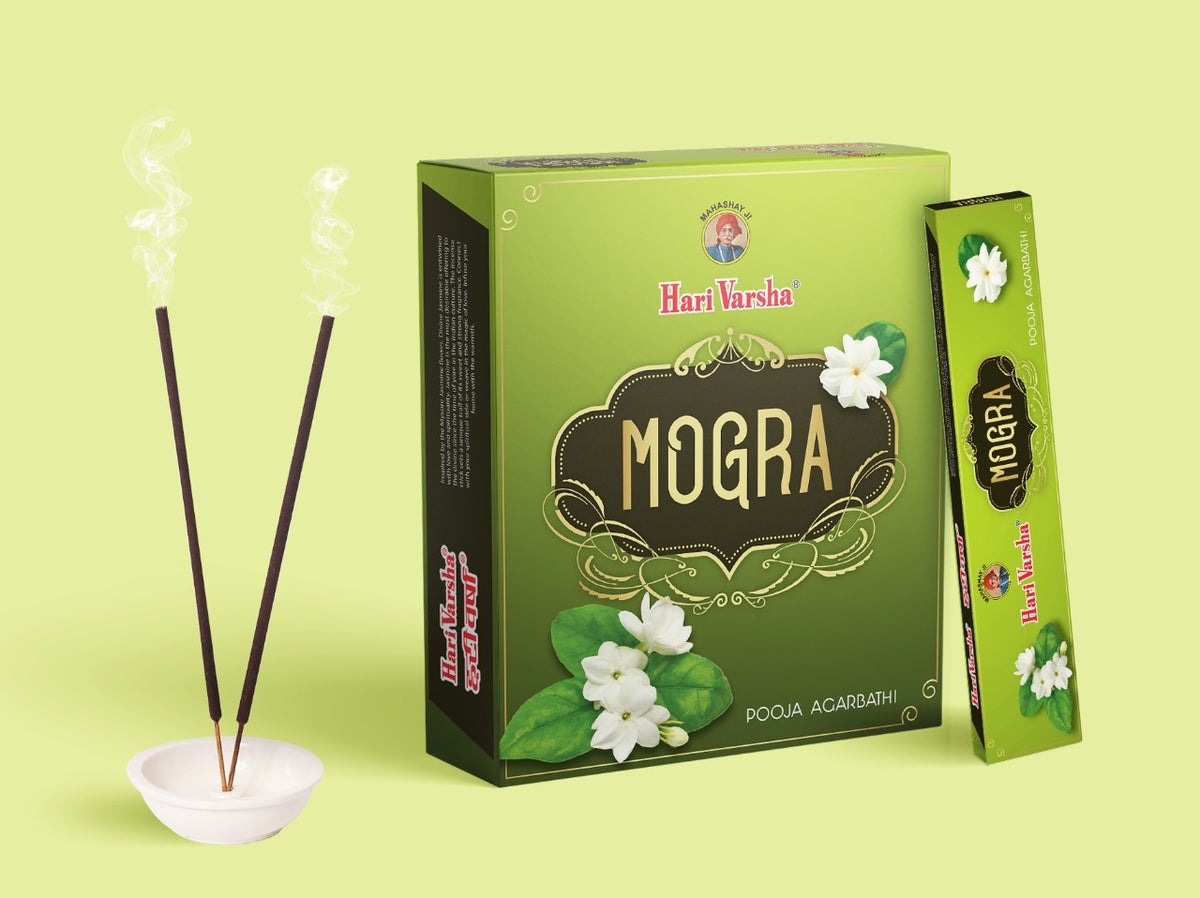 Hari Varsha Mogra Incense Sticks burning in holder with product box and single pack